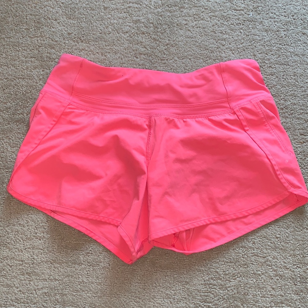 Lululemon pink shorts. Salmon pink not hot pink.